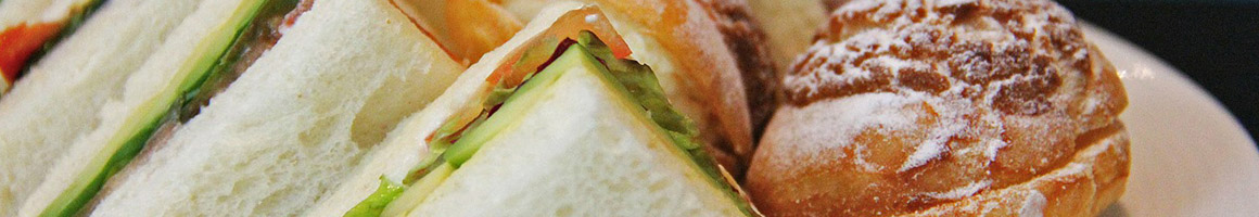 Eating Sandwich at New Bridge Variety & Deli restaurant in Danvers, MA.